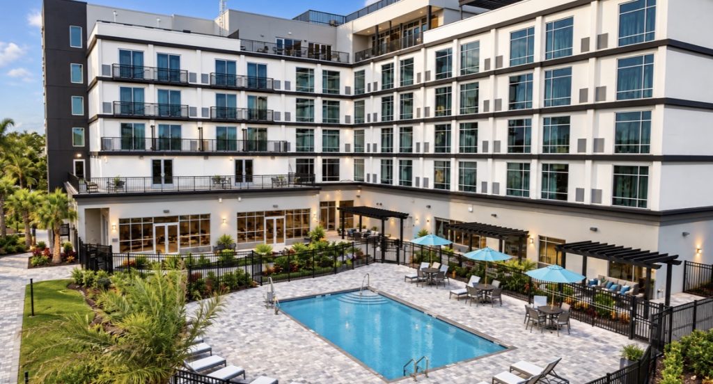 Pool courtyard and guest-room balconies at Cambria Hotel Jacksonville